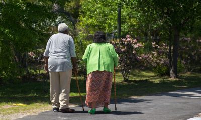 Older Adult Couple Walking in Park